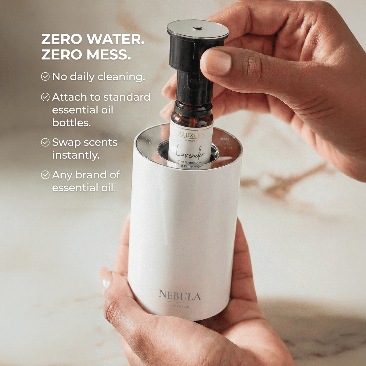 White Nebula diffuser with woman inserting cartridge with essential oil attached