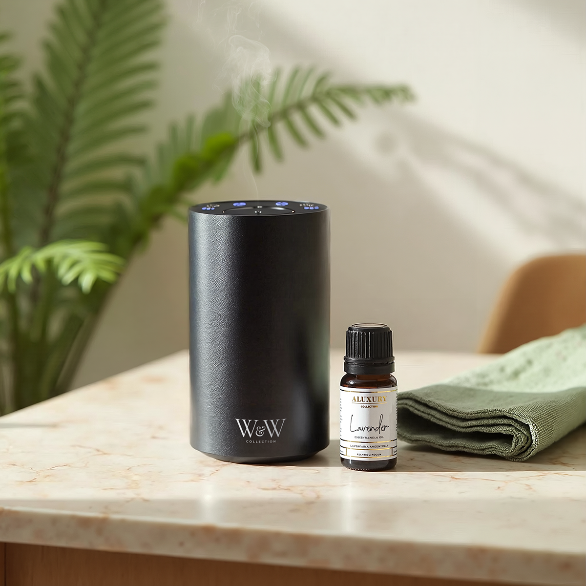 Nebula diffuser in black with lavender essential oil bottle